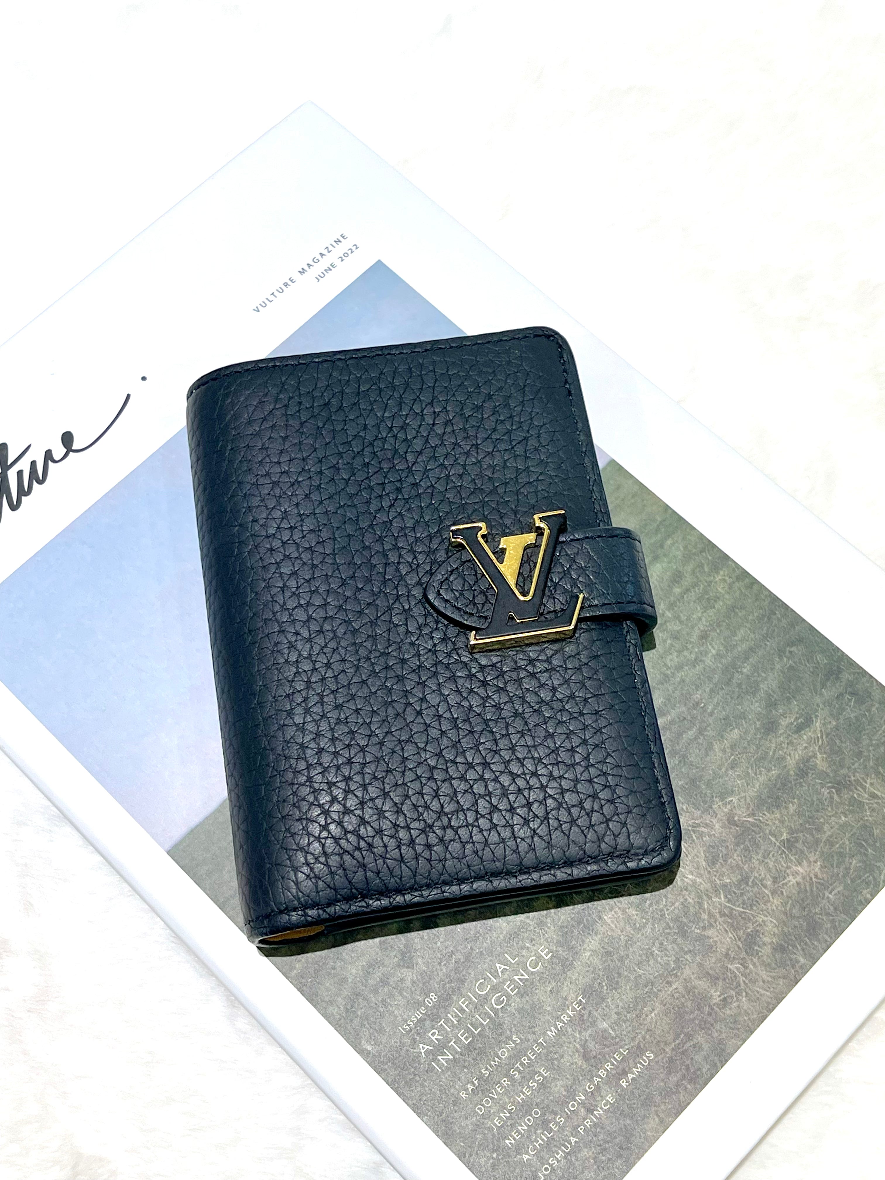 LV Vertical Compact wallet